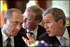 President George W. Bush talks with Russian President Vladimir Putin during a working lunch in the Blue Room
